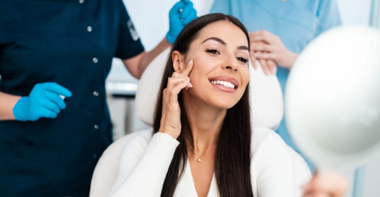 a woman smiling with hands on her face | ANEU Medical Spa, LLC | Madison | McFarland, WI