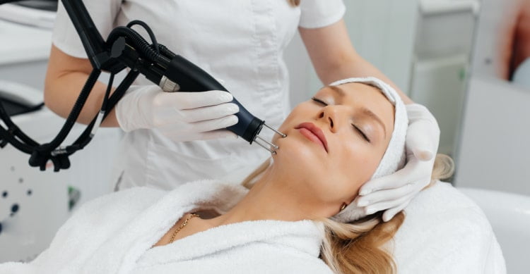 a woman getting a laser skin resurfacing treatment | ANEU Medical Spa, LLC | Madison | McFarland, WI