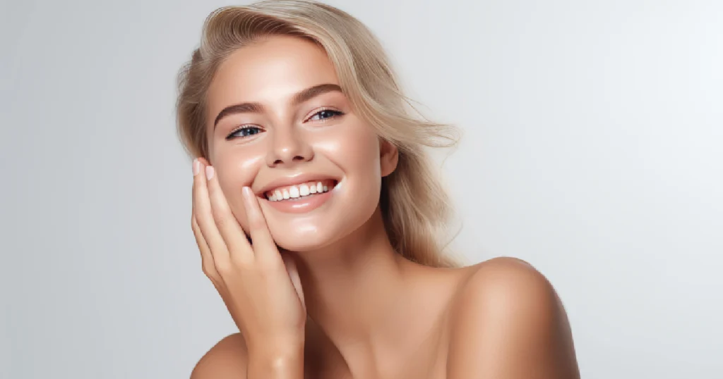 Smiling woman with glowing, radiant skin after treatment showcasing results of gentle chemical peels in Madison, WI