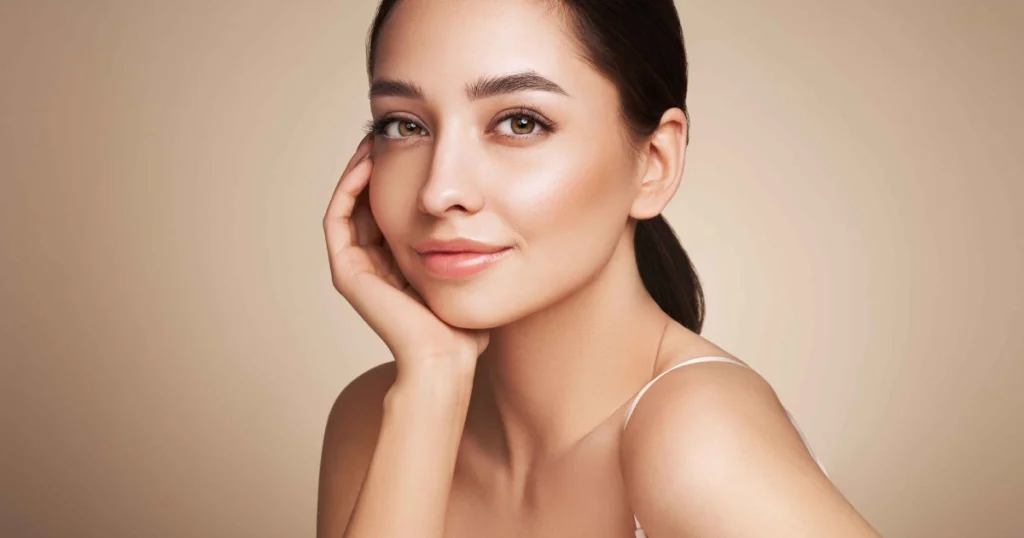 Woman showing smooth, radiant skin after MicroTox treatment in Madison, WI